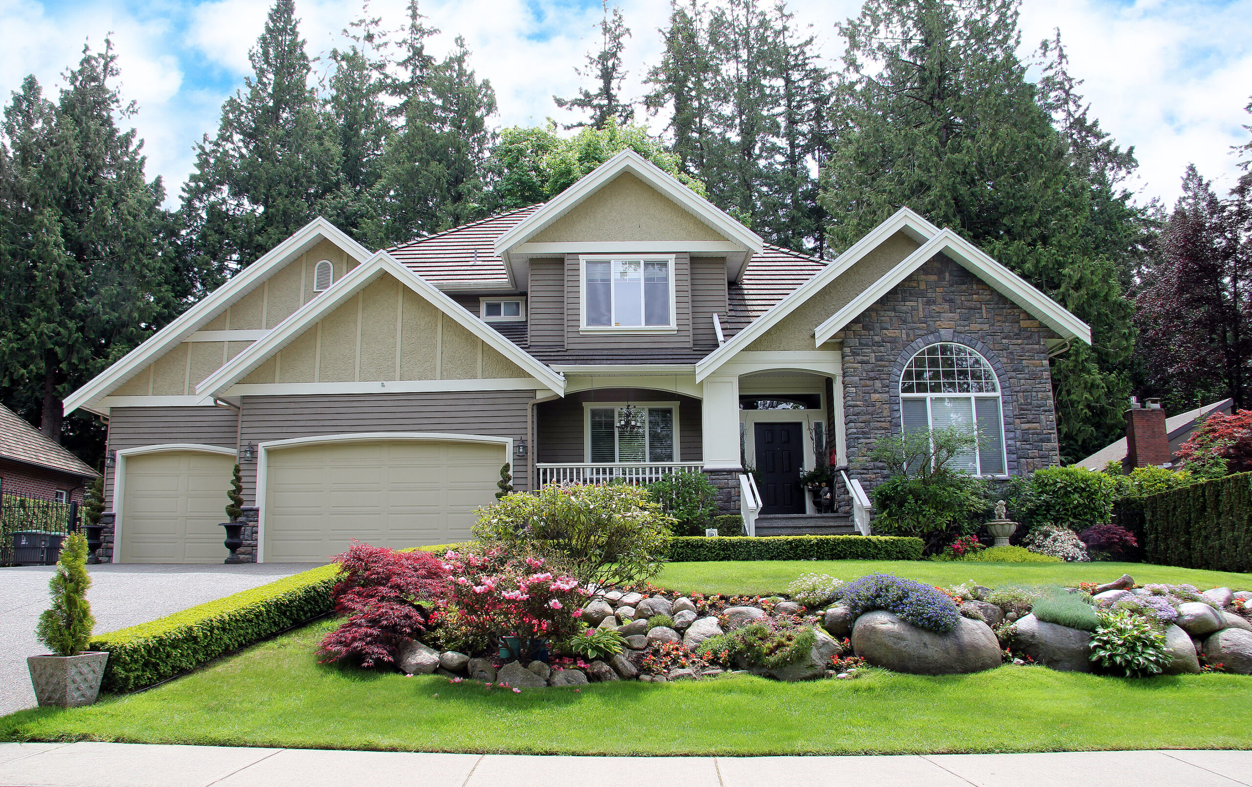 luxurious canadian mansion with a large professionally landscape